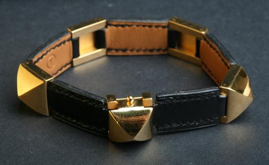 HERM?S BLACK LEATHER AND GOLD