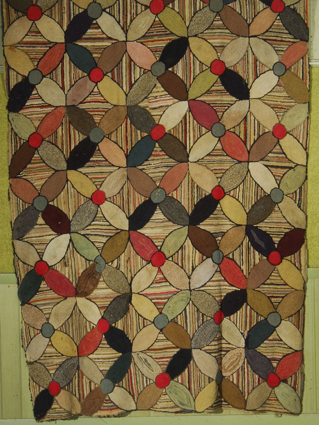 HOOKED RUGFive rows of stylized