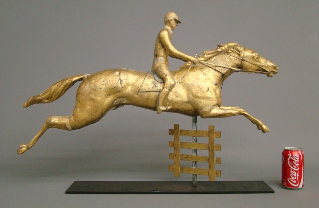 Horse and rider jumping over