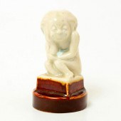 HUNCHED FIGURE ON PEDESTAL - R