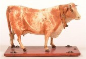 HYDE COVERED COW PULL TOY.Hyde