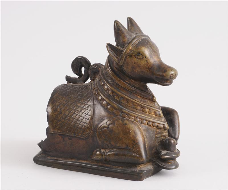 INDIAN BRONZE FIGURE OF A RECUMBENT