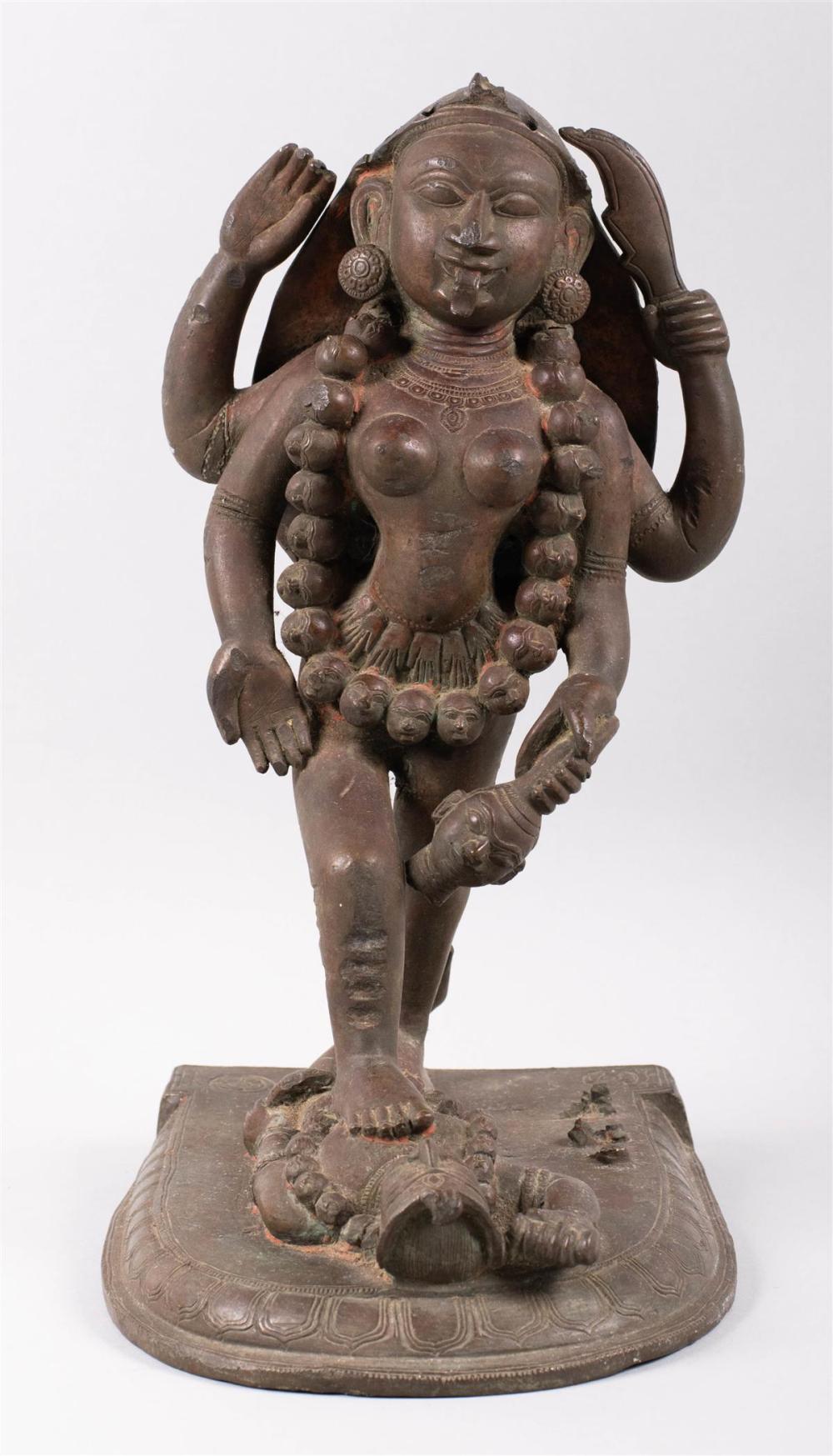 INDIAN BRONZE STRIDING FIGURE OF