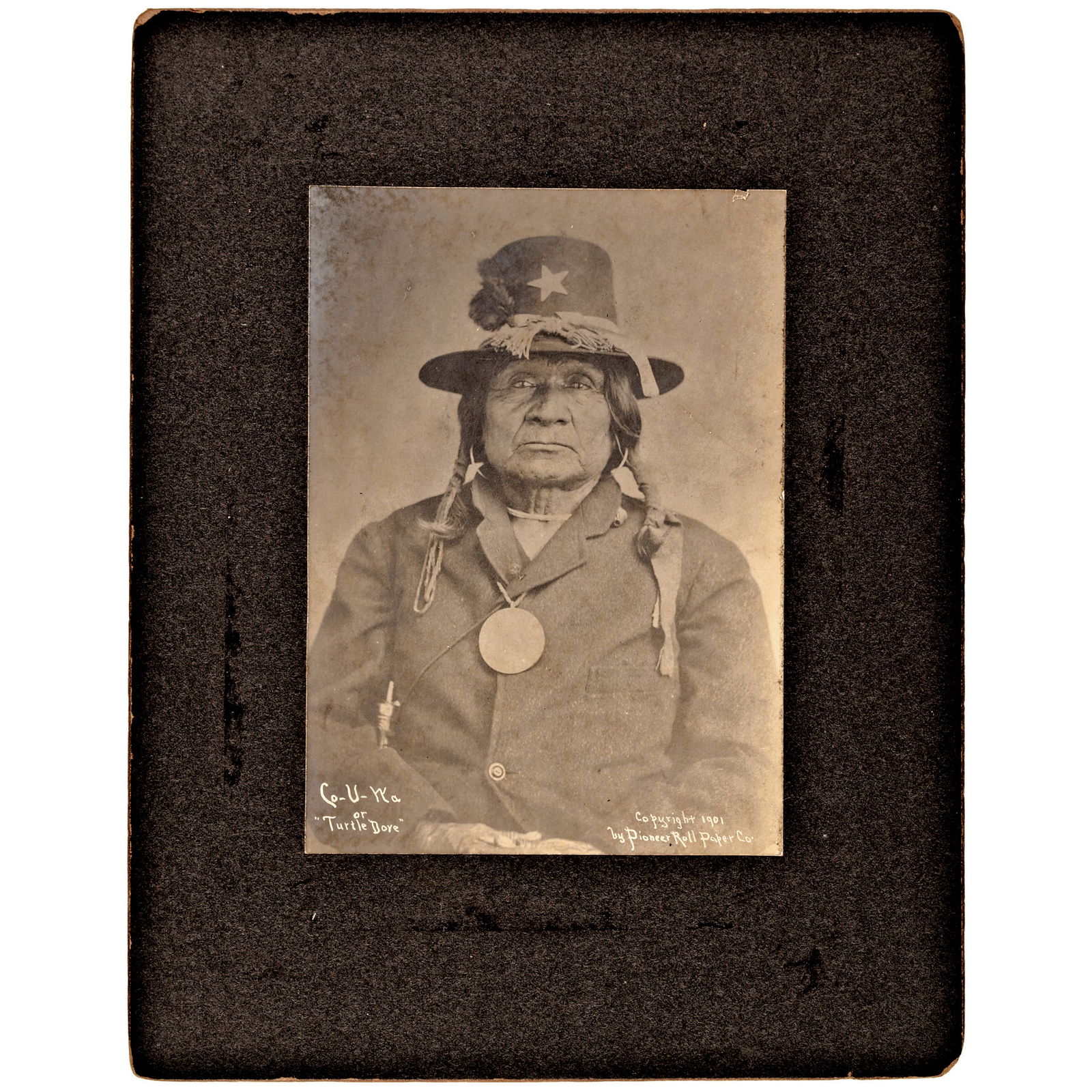 INDIAN CHIEF WEARING A SILVER PEACE