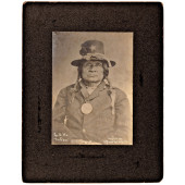 INDIAN CHIEF WEARING A SILVER