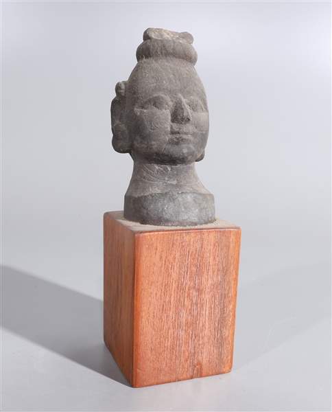 Indian stone head attached to