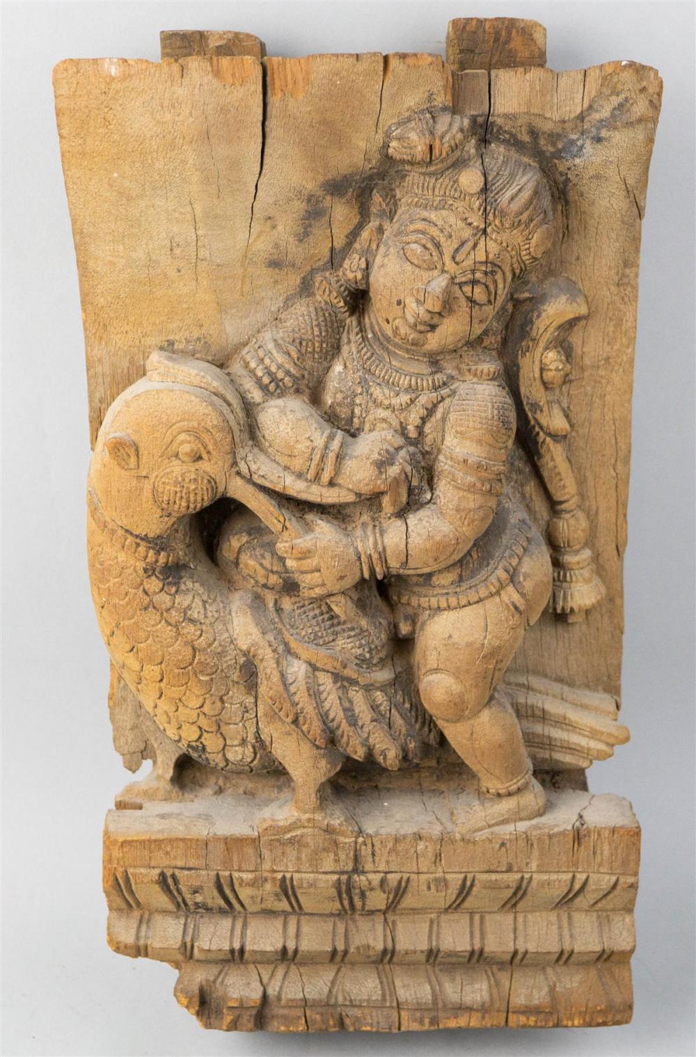 INDIAN WOOD CARVING OF A DEITY ON