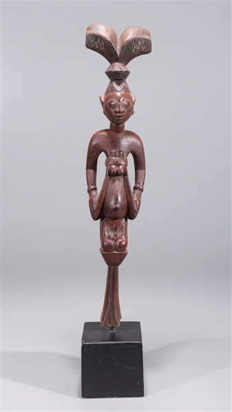 Intricately carved wood topper of