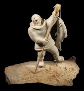 INUIT CARVING OF A FISHERMAN,