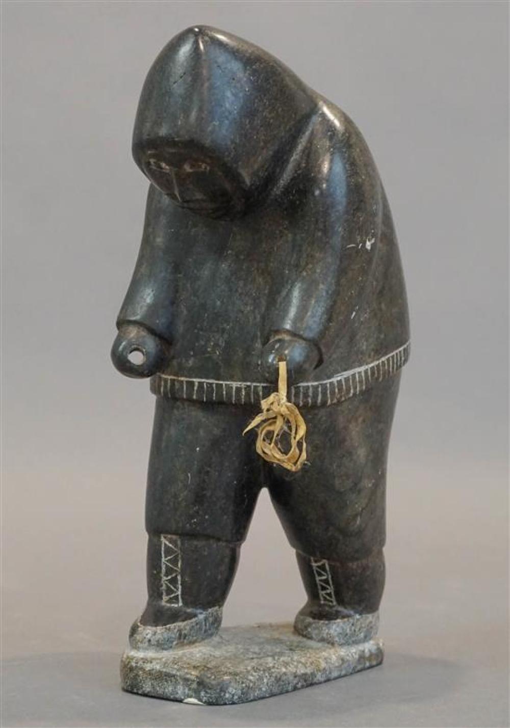 INUIT SCULPTURE OF A TRAVELING MAN,