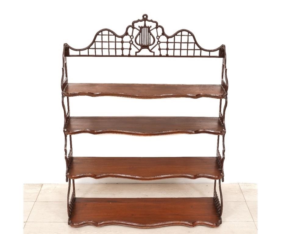 Iron and mahogany hanging shelf,