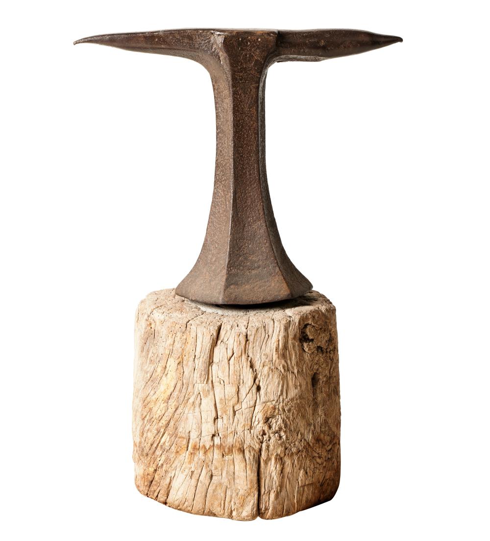 IRON ANVILaffixed to rootwood