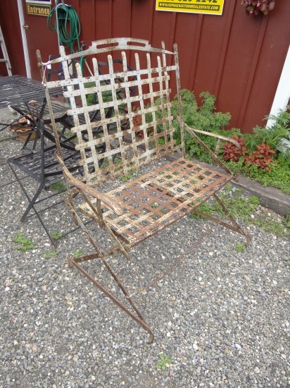 Iron garden bench. Back has woven