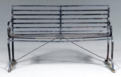 Iron garden bench, scrolled arms