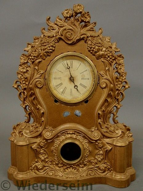 Iron shelf clock with gilt paint