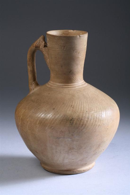 ISLAMIC OCHRE POTTERY EWER. - 7 in.