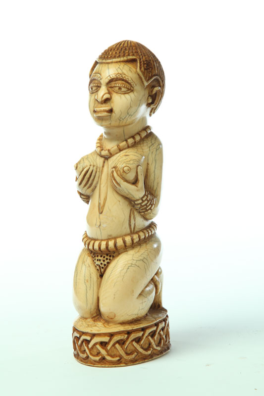 IVORY CARVING OF A WOMAN. 