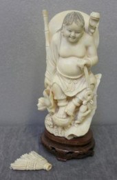 Ivory Figure with a Broom.From