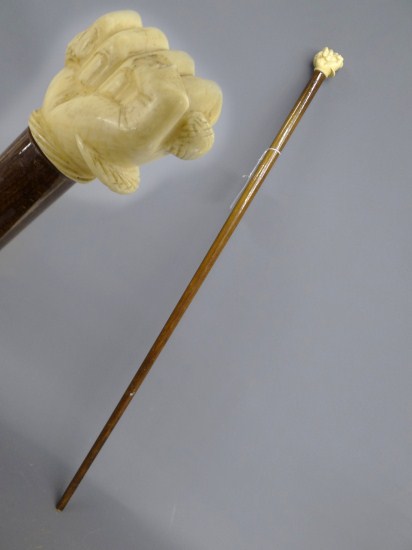 Ivory fist with snake cane. 33