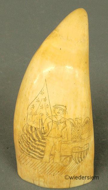 Ivory scrimshaw whale's tooth