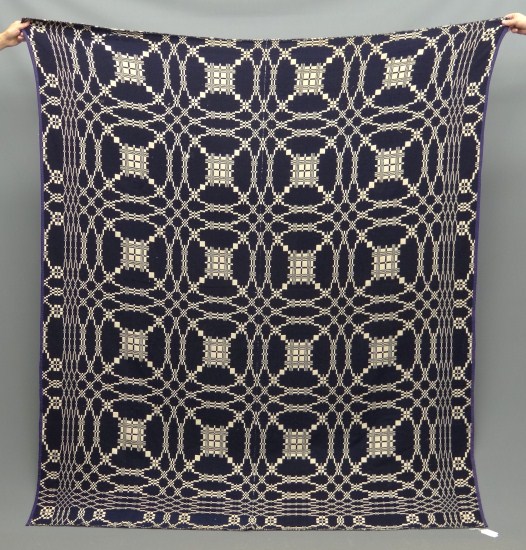 Jacquard blue and white coverlet.