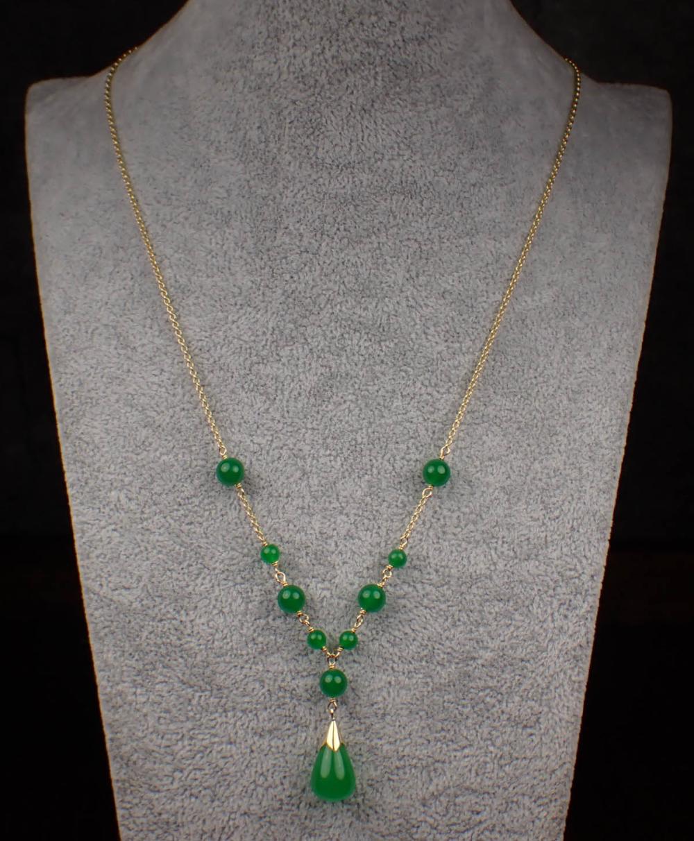 JADE AND FOURTEEN KARAT GOLD
