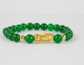 JADE AND TWENTY-FOUR KARAT GOL