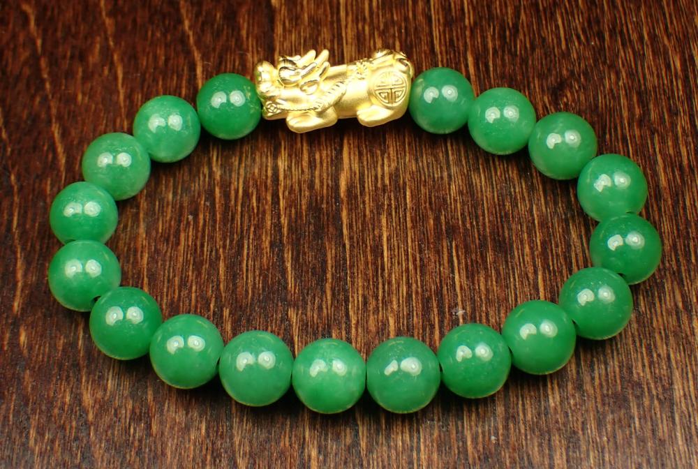 JADE AND TWENTY-TWO KARAT GOLD FENG