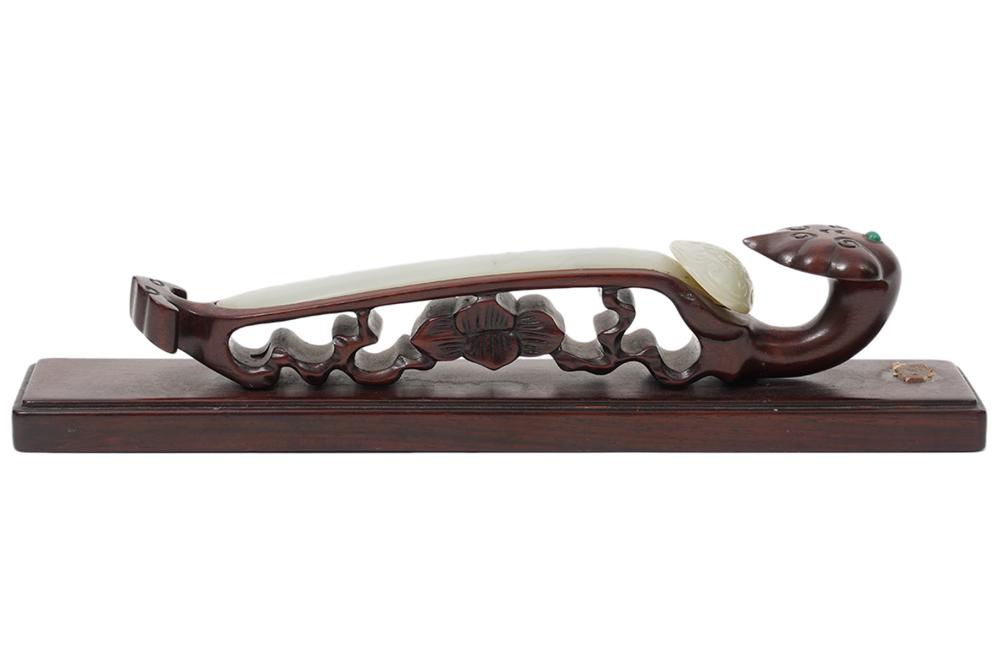 JADE SCEPTER ON CARVED WOOD