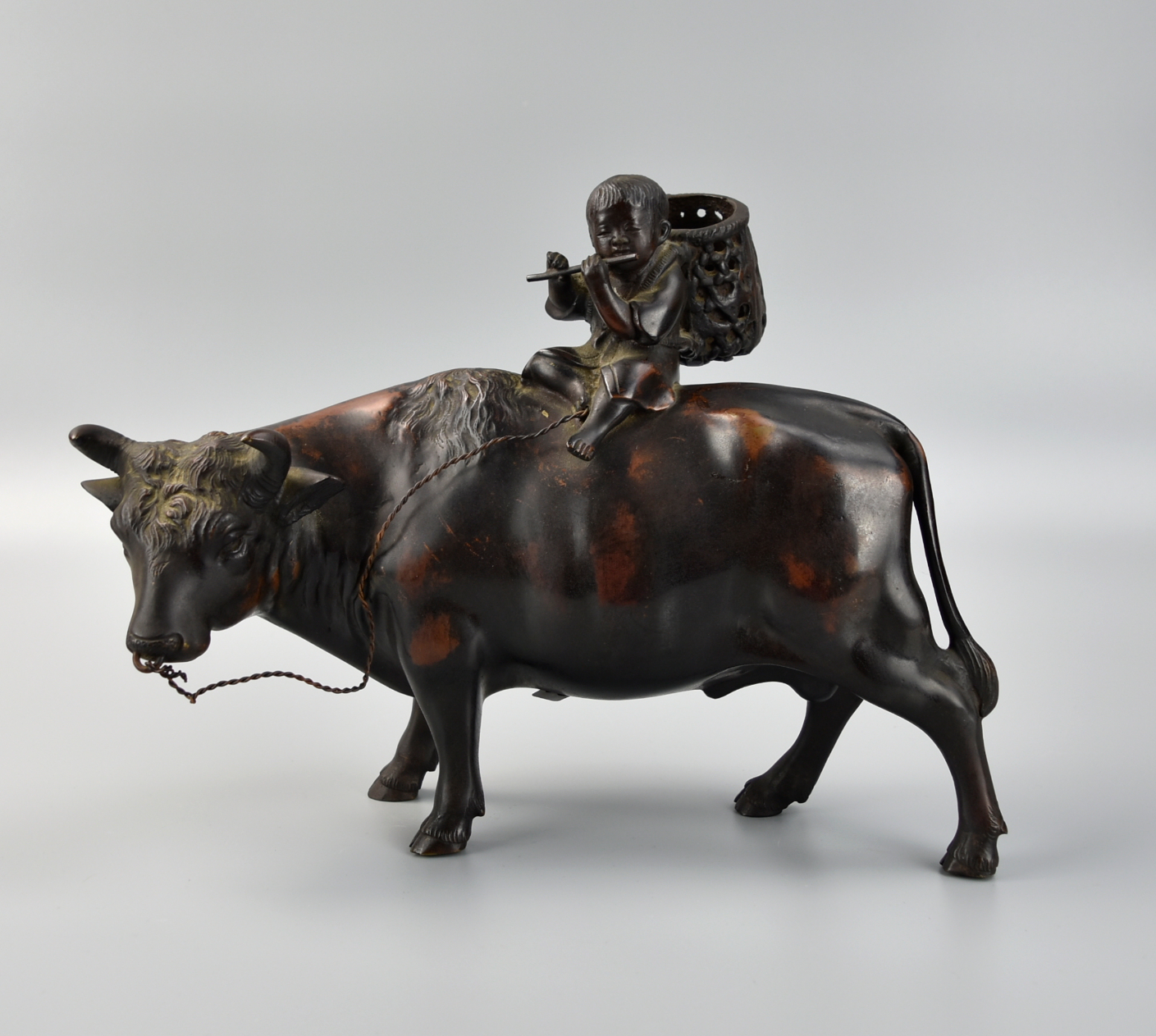 JAPANESE BRONZE BOY RIDING ON OX,