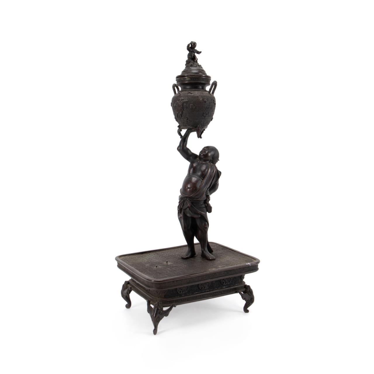 JAPANESE BRONZE FIGURE HOLDING A
