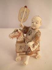 JAPANESE CARVED BOY ON HOBBY H