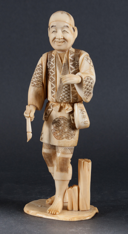 Japanese carved ivory figure of a