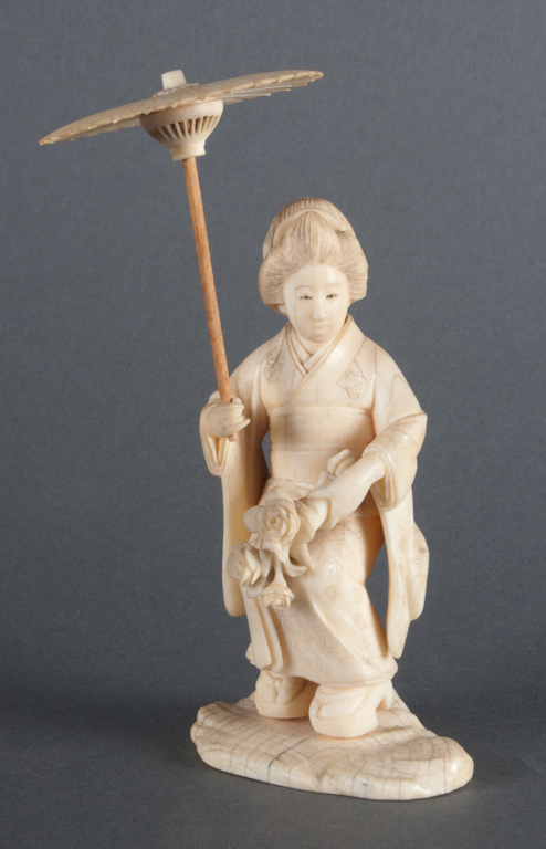 Japanese carved ivory figure of a