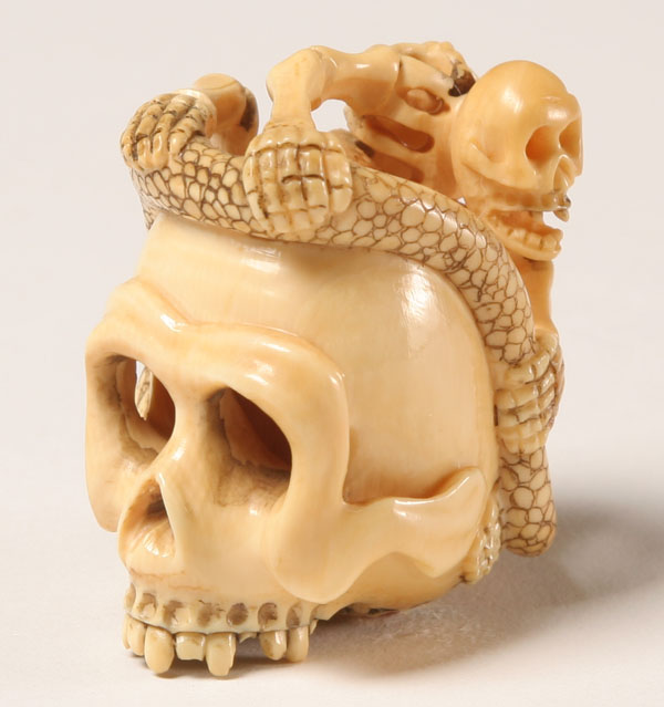 Japanese carved ivory netsuke; a