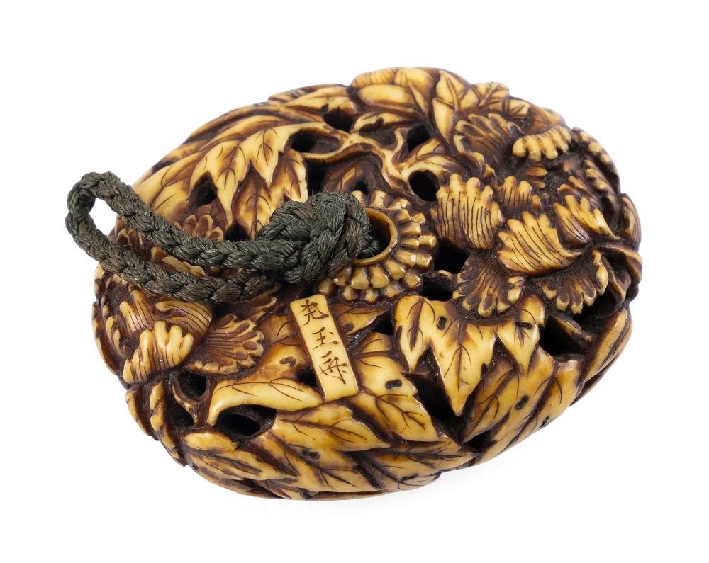 JAPANESE CARVED STAINED IVORY MANJU