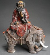 JAPANESE CERAMIC FIGURE OF A S