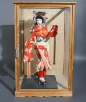 JAPANESE GEISHA DOLL IN DISPLA