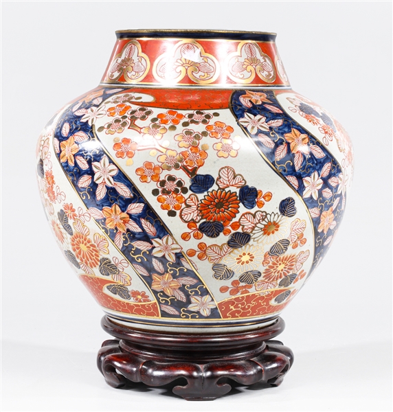 Japanese Imari jar with carved wood