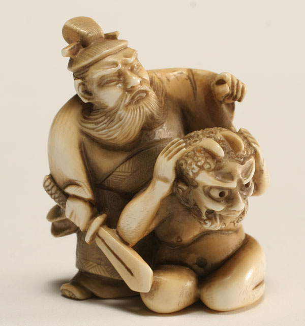 Japanese ivory netsuke; armed