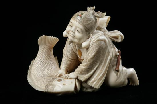 JAPANESE IVORY OKIMONO OF FISHERMAN