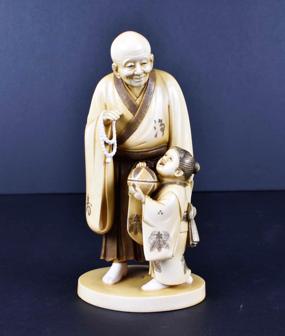 JAPANESE TEA STAINED OKIMONO OF A