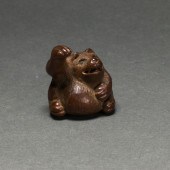 JAPANESE WOOD NETSUKE OF A BAD