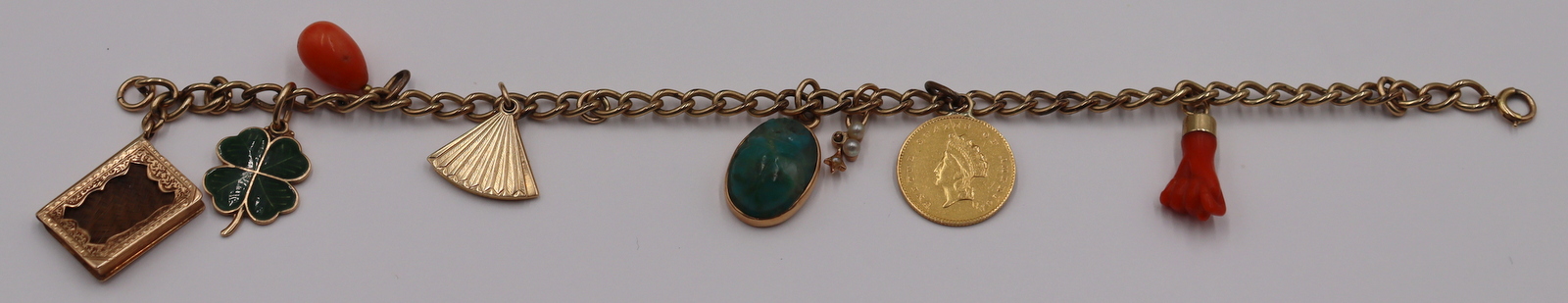 JEWELRY. 14KT GOLD CHARM BRACELET