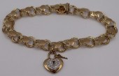 JEWELRY. 14KT GOLD CHARM BRACE
