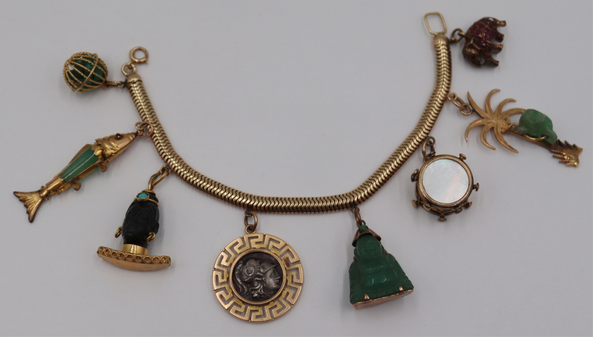 JEWELRY. 14KT GOLD CHARM BRACELET