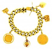 JEWELRY: 18K CHARM BRACELET WI
