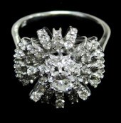 JEWELRY: 18K GOLD DIAMOND CLUS