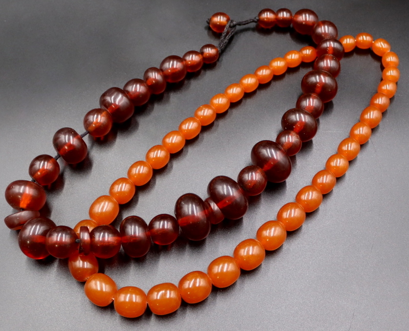 JEWELRY. (2) CHINESE AMBER