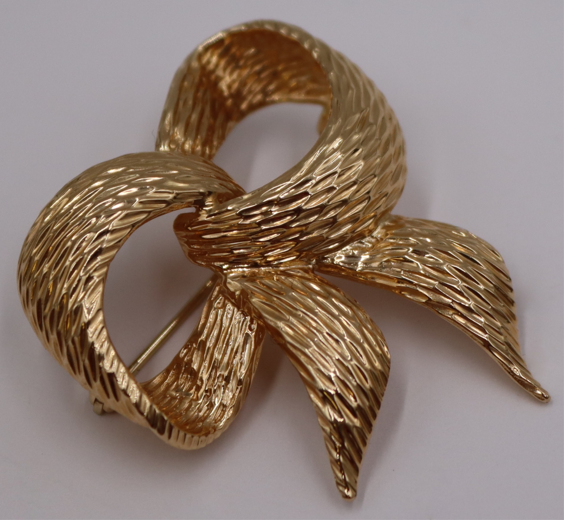 JEWELRY. DANKNER 14KT GOLD BOW FORM